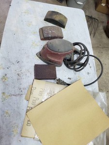 Palm sander, sanding blocks and sheets of sandpaper