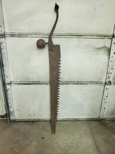 Vintage ice saw with weight ball