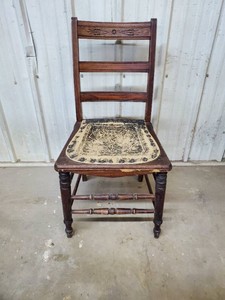 Antique wood chair with leather seat