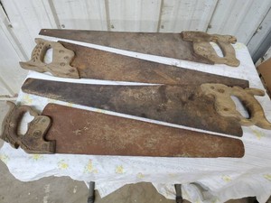 4 vintage handsaws 2 are Disston brand