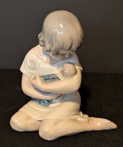 Porcelain Figurine - Royal Copenhagen Child Holding Baby Model 121