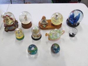 Assorted Snow Globes and Glass Paperweights  Wizard of Oz, Precious Moments & Animal Designs