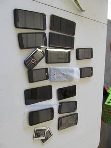 Lot of Approximately 15 Assorted Cell Phones for Parts or Repair