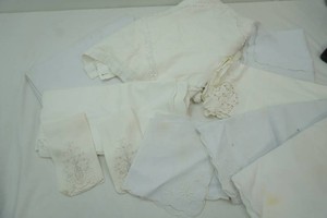 Many Fancey cloth placemats and table covers