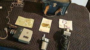 Honeywell Elmo 82 with remote connector, Elmo zoom grip, sun gun II movie light and misc bag
