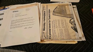 folder of newspaper clippings of tonka articles and email responses to employees