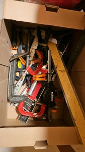 box of C-clamps and tools