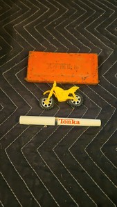 Tonka twist of ball point pen, old motorcycle and tonka hatch
