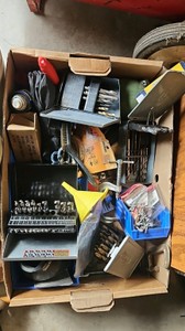 Drill bits in box with odds and ends