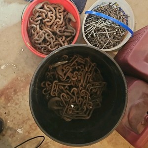 Buckets of nails and chains