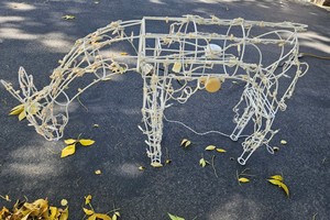 moving white wire-frame grazing or feeding reindeer outdoor Christmas decoration roughly 28 tall