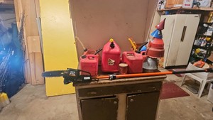 Gas cans and electric pole saw