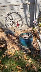 Planter with solar lights and decor wagon wheel