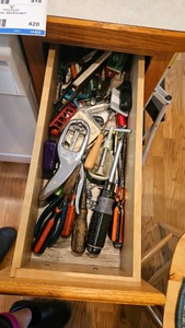 Kitchen drawer of hand tools and step stool