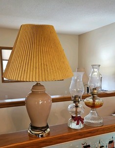 Kerosene lanterns and pink lamp