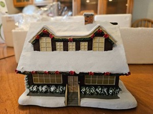 Holiday Celebration lighted building sculpture from Terry Redlins Winter Memories Village collection by Hawthorne Village