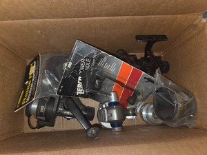 Box of old reels and parts