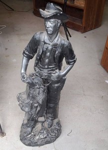 RARE Mexican Folk Art Statue of a Cowboy holding a saddle