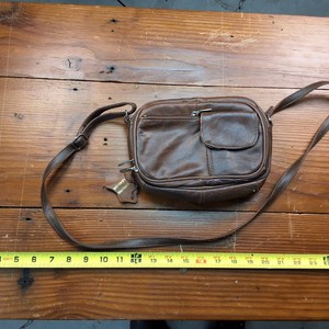 Brown leather purse with unique little pocket up front