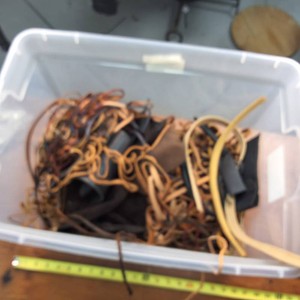 Bin full of leather cordage