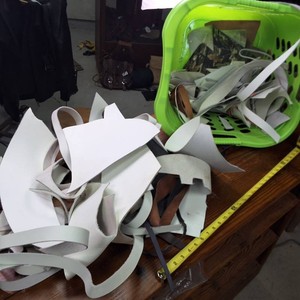 Lime Green Laundry Basket chock full o white leather cut-offs