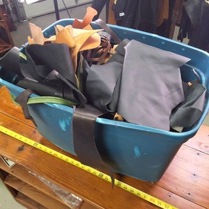 Blue tote chock full o many types of leather scraps