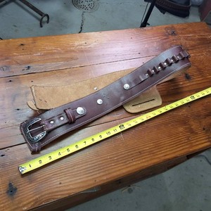 Brown leather ammo belt with holster slot