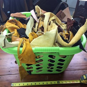 Laundry basket chock full o Leather Scraps
