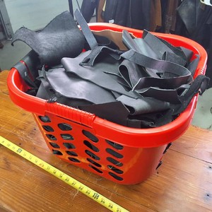 Tub chock full 0 Black leather scraps