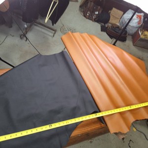 Two large pieces of leather  One Black, One Tan