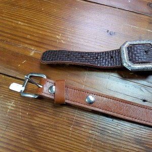 Embossed black leather belt and brown leather belt