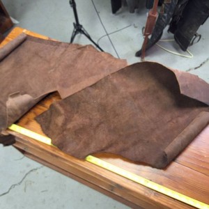 Two pieces of Dark Dyed Leather