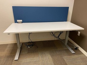 Height-Adjustable Office Desk With Blue Privacy Panel & Power Outlets