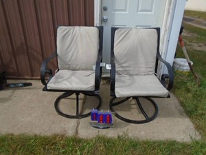 2 swivel lawn chairs with pads. Look nearly new. As shown.