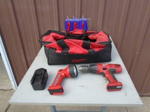 Milwaukee 18 volt flashlight & drill with bag. No charger. As shown.