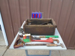 Wood box with assorted tools. Pipe wrench, plane, & ice picks & etc. As shown.