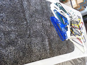 31 Hangers and 1 Accent Rug in a Storage Tub