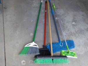 5 Brooms and More- in a wastebasket
