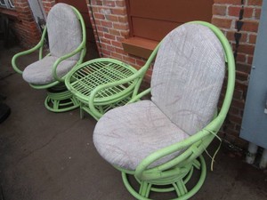 Pair of wood frame swivel chairs with side table