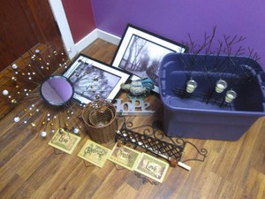 Lot of home decor in a plastic tote