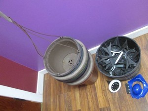 Basket full of solar powered LED patio lights, hanging baskets and Snowjoe ice scraper