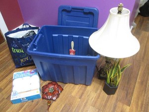 Covered tote filled with painting supplies and home decor