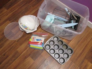 Lot of kitchen ware in a plastic tote