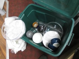 Covered tote filled with glassware