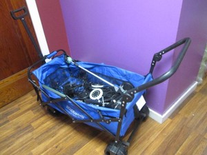 Heavy duty collapsible cart filled with solar lights and patio goodies