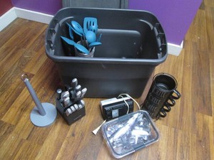 Covered tote filled with kitchen supplies