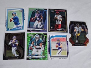 Lot of 7 Quarterbacks Football Cards featuring Jalen Hurts, Lamar Jackson, Kenny Pickett, JJ McCarthy and other notable players. Includes Rookie, Prizm, and Select cards.