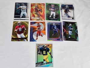 Lot of 9 Football Cards Featuring Steve Young, Travis Kelce, Drew Brees, Thurman Thomas, Greg Rousseau RC, Michael Pittman Jr. RC, and Charles Woodson.
