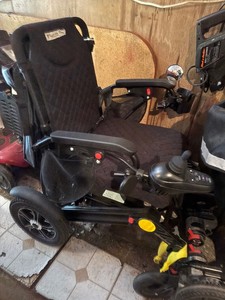 Electric wheel chair with battery and charger