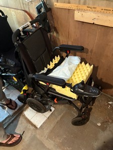 Electric wheelchair with battery and charger